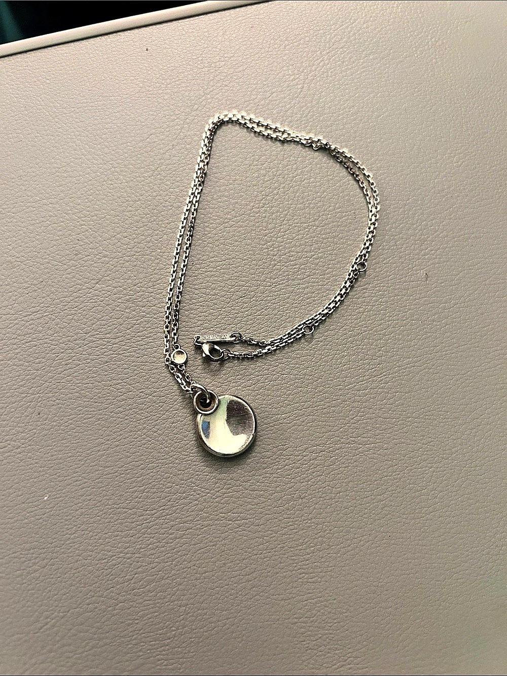 Movado Silver  Charm Long Pendant Necklace
